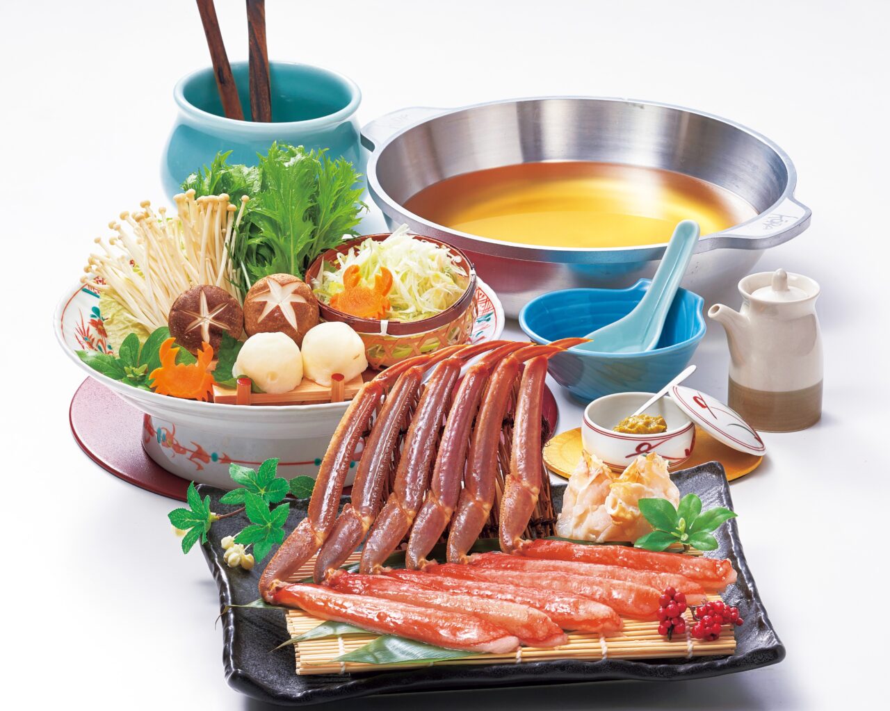 単品かにしゃぶの盛り付けイメージ。出汁鍋と野菜、蟹脚が美しく配置されています。