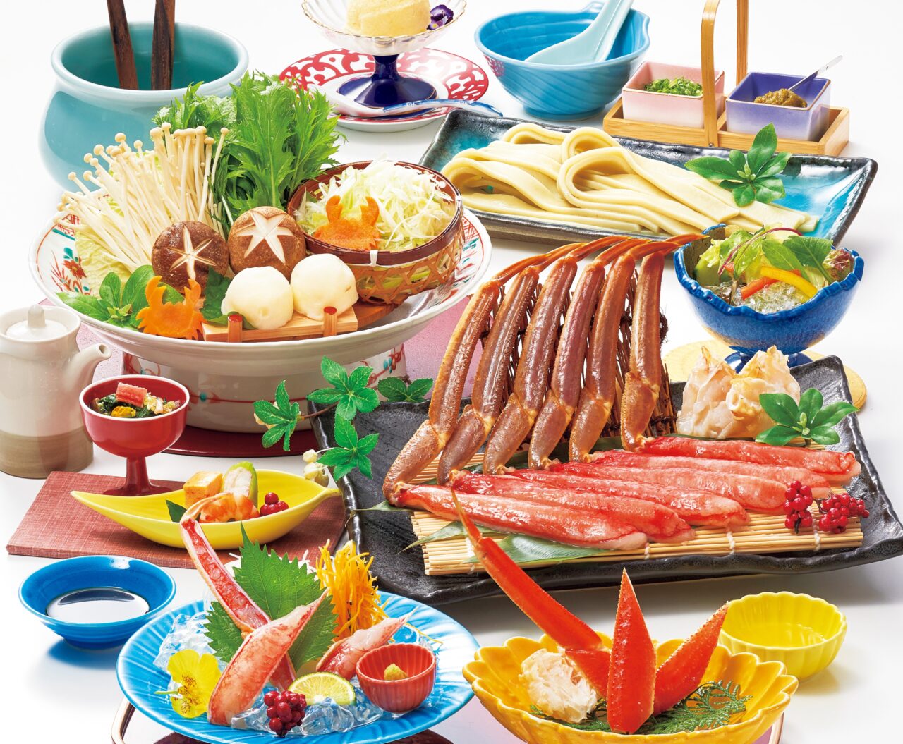 かにしゃぶ会席の料理イメージ。色とりどりの器に蟹料理が並んでいます。